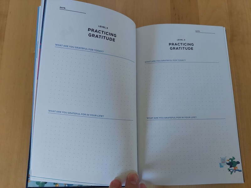 Photograph of the inside pages of a Kurtzgesagt gratitude journal